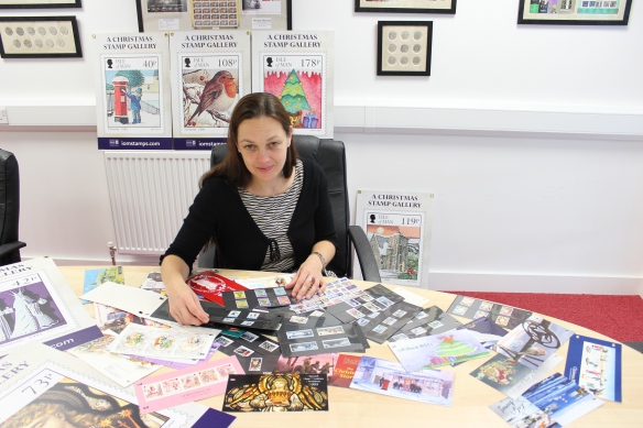 Designer Emma Cooke of EJC Design with the collection of Christmas stamps issued over the past 40 years